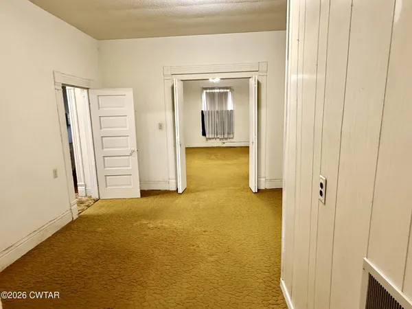 an empty room with windows