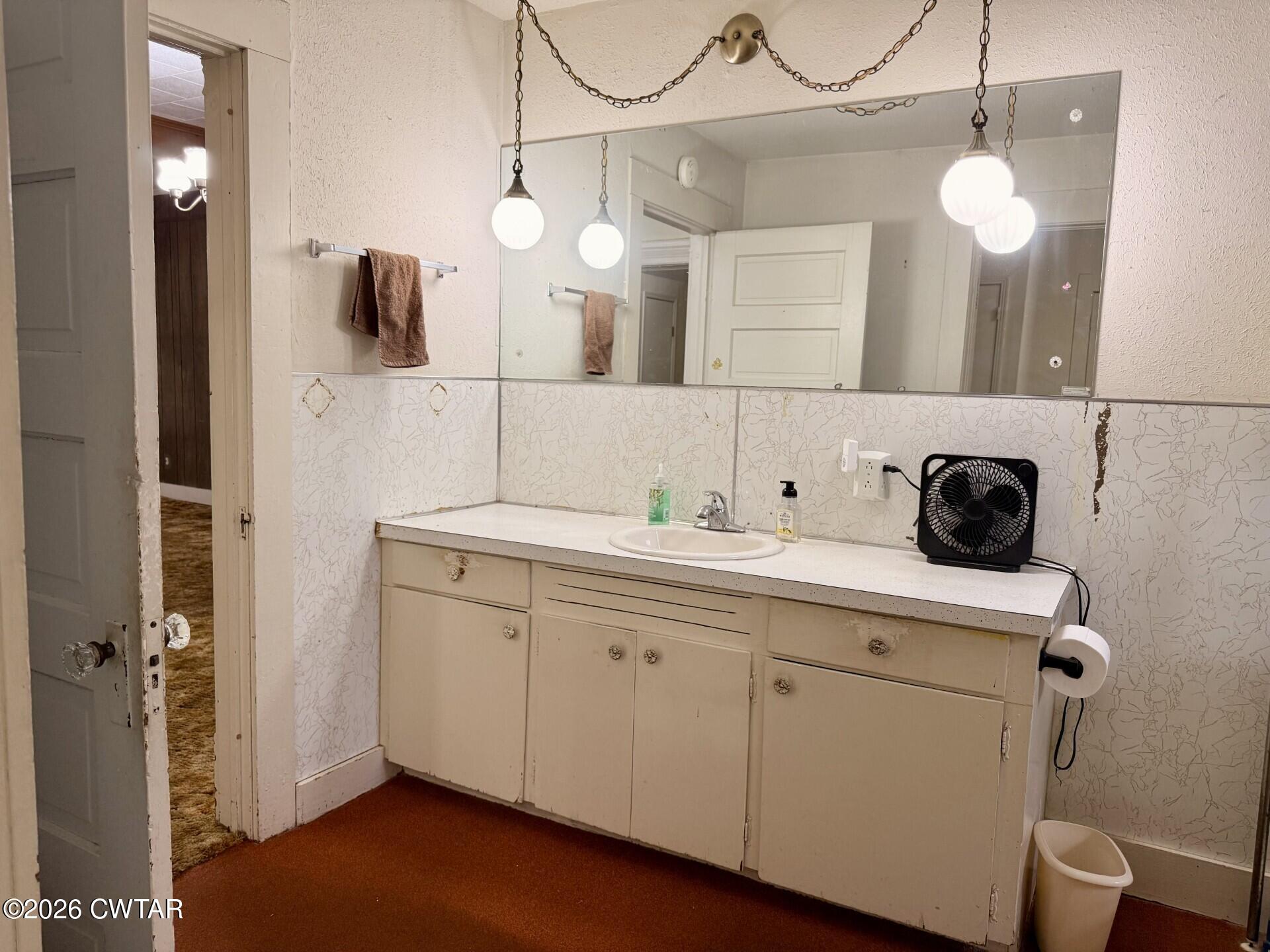 406 Maple Heights Street Kenton, TN 38233 - Photo 27 of 43 a bathroom with a sink and a mirror