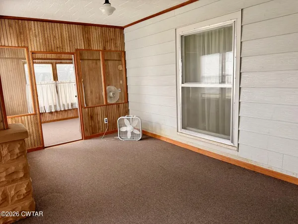 a view of a balcony with wooden floor