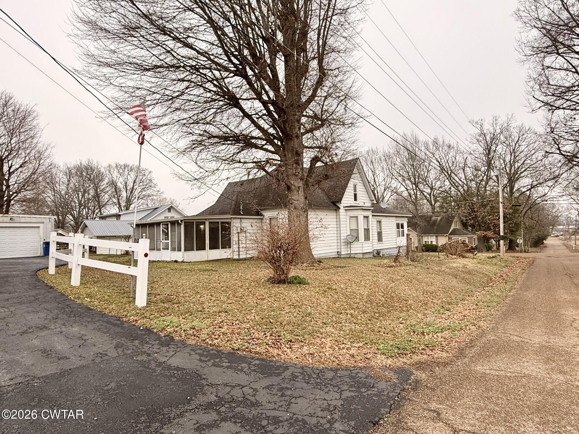 406 Maple Heights Street Kenton, TN 38233 - Photo 43 of 43 a view of a house with a yard and garage