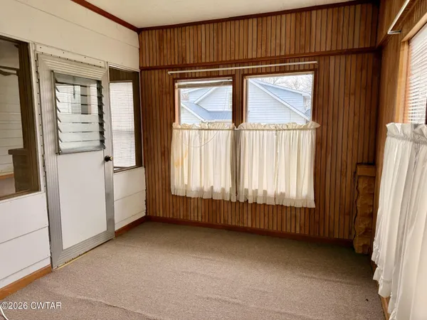 an empty room with windows