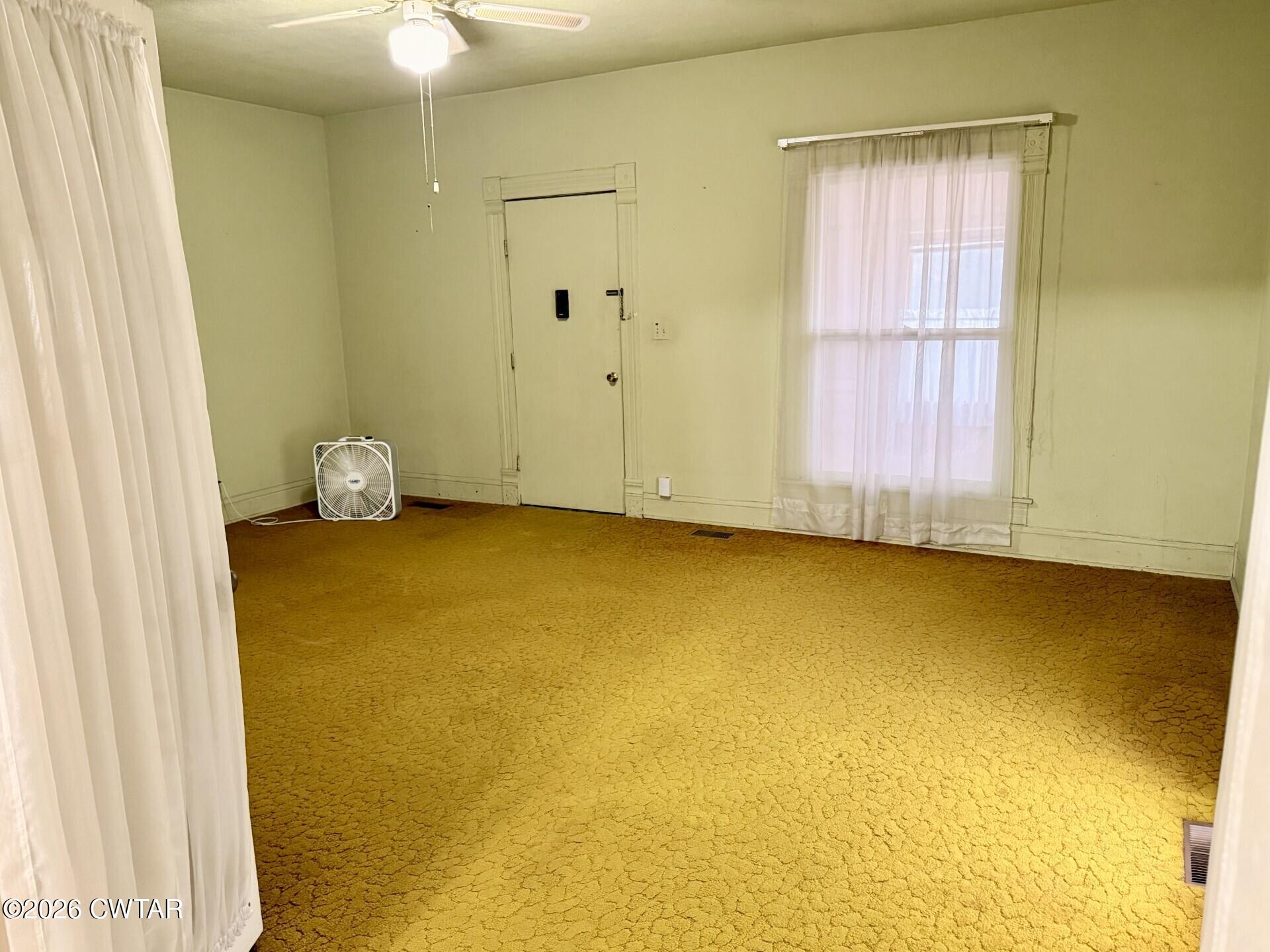 406 Maple Heights Street Kenton, TN 38233 - Photo 7 of 43 a view of an empty room with a window