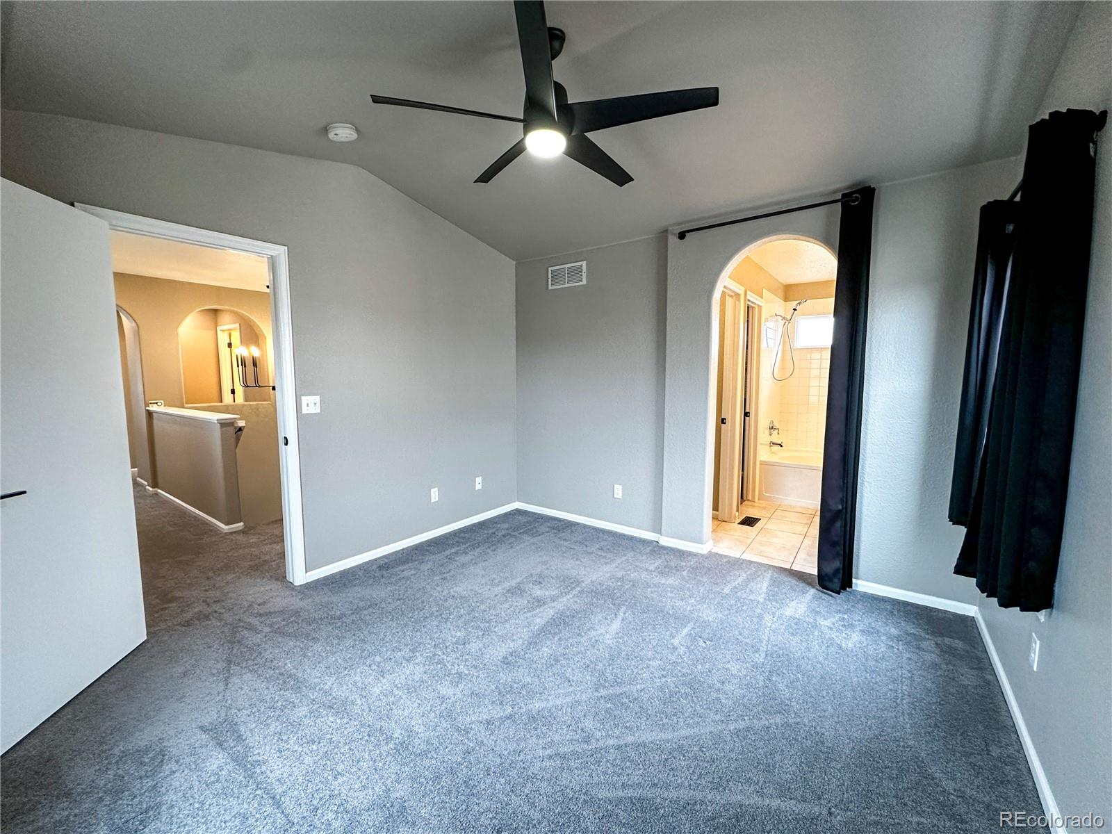 9933 Harris Street Denver, CO 80229 - Photo 14 of 25 an empty room with closet and a window