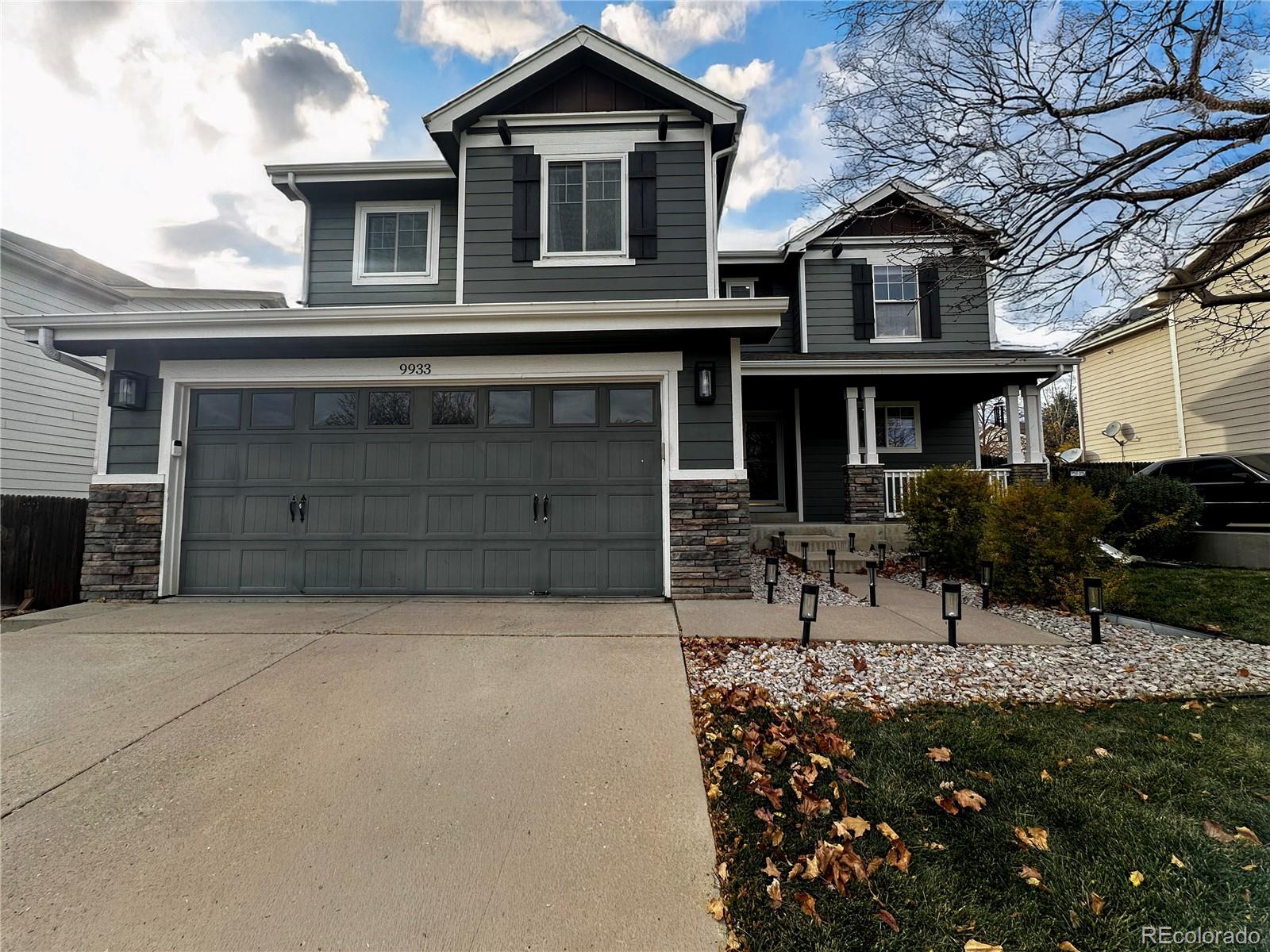 9933 Harris Street Denver, CO 80229 - Photo 2 of 25 a view of a house with a yard