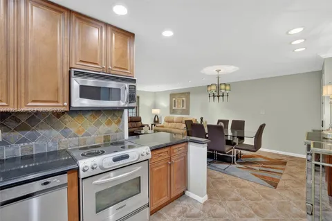 a bedroom with a bed and a dresser in it