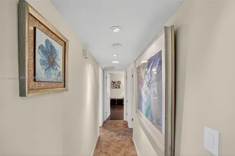 a kitchen with stainless steel appliances granite countertop a refrigerator and a stove