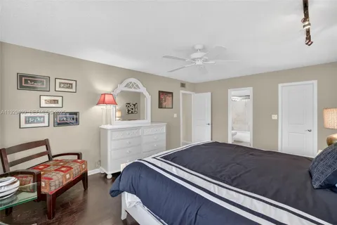 a car parked in front of a house with a yard