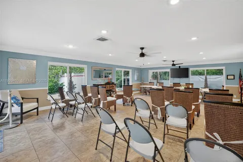 an aerial view of residential building and lake