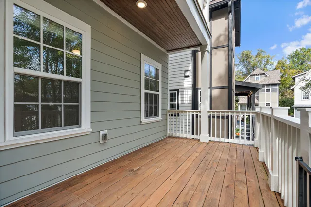a view of a brick house with large windows