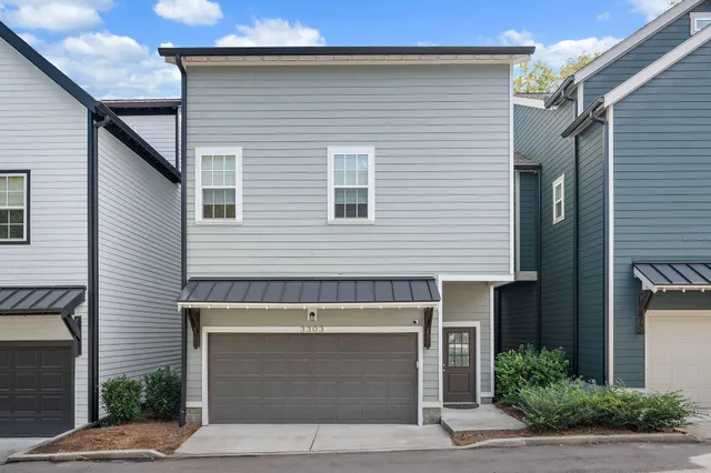 a view of a house with a street