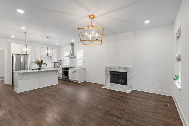 a view of kitchen with cabinets and wooden floor