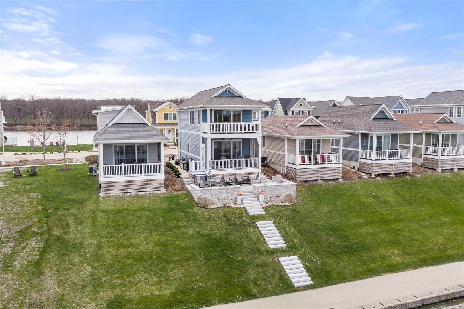 224 Leeward Way Ottawa, IL 61350 - Photo 12 of 58 a front view of a house with a yard table and chairs