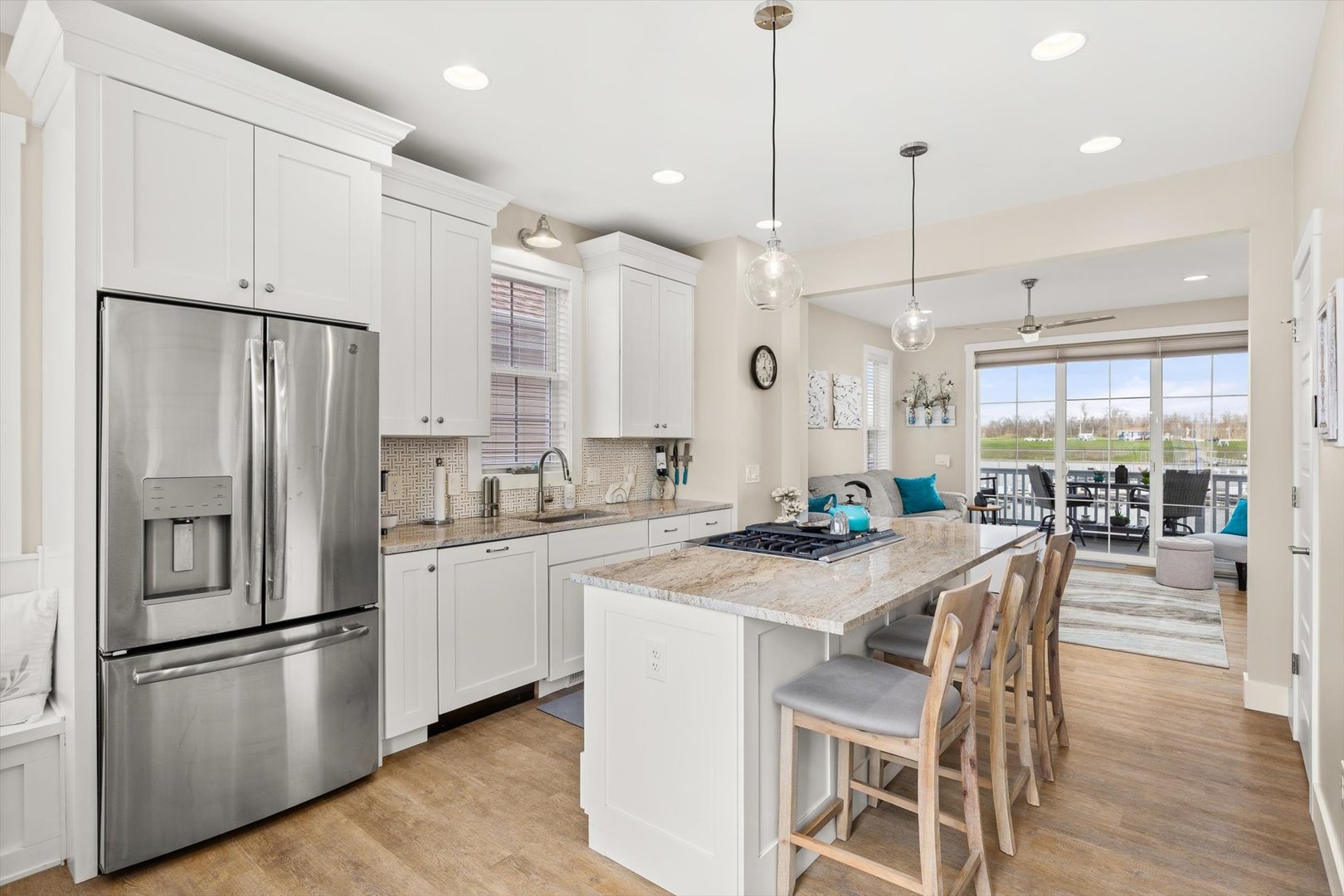 224 Leeward Way Ottawa, IL 61350 - Photo 13 of 58 a kitchen with stainless steel appliances granite countertop a refrigerator a sink a stove a dining table and chairs