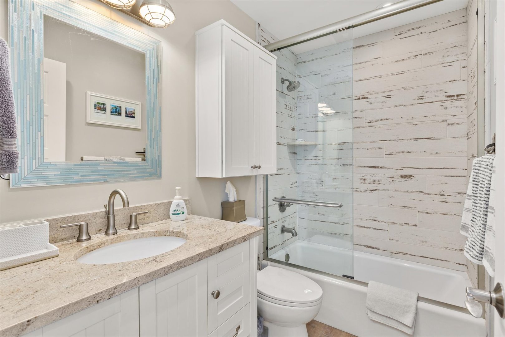 224 Leeward Way Ottawa, IL 61350 - Photo 30 of 58 a bathroom with a granite countertop sink a toilet and shower