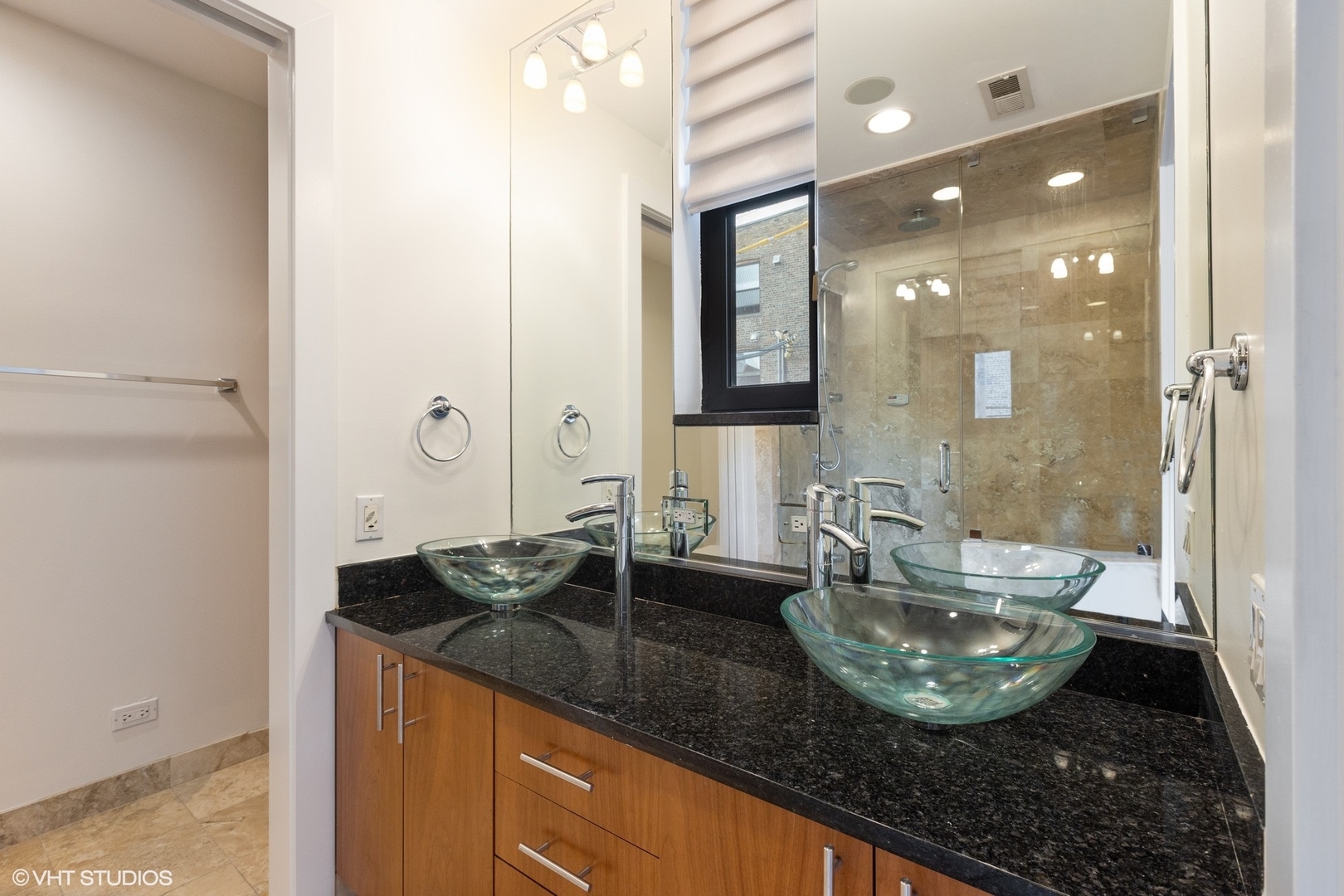 3310 North Halsted Street, Unit 2 Chicago, IL 60657 - Photo 13 of 22 a bathroom with a granite countertop sink a mirror and shower