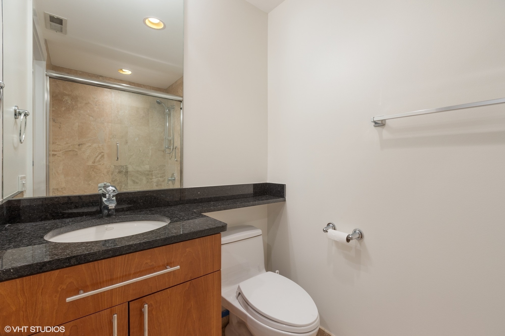 3310 North Halsted Street, Unit 2 Chicago, IL 60657 - Photo 16 of 22 a bathroom with a granite countertop sink toilet and mirror