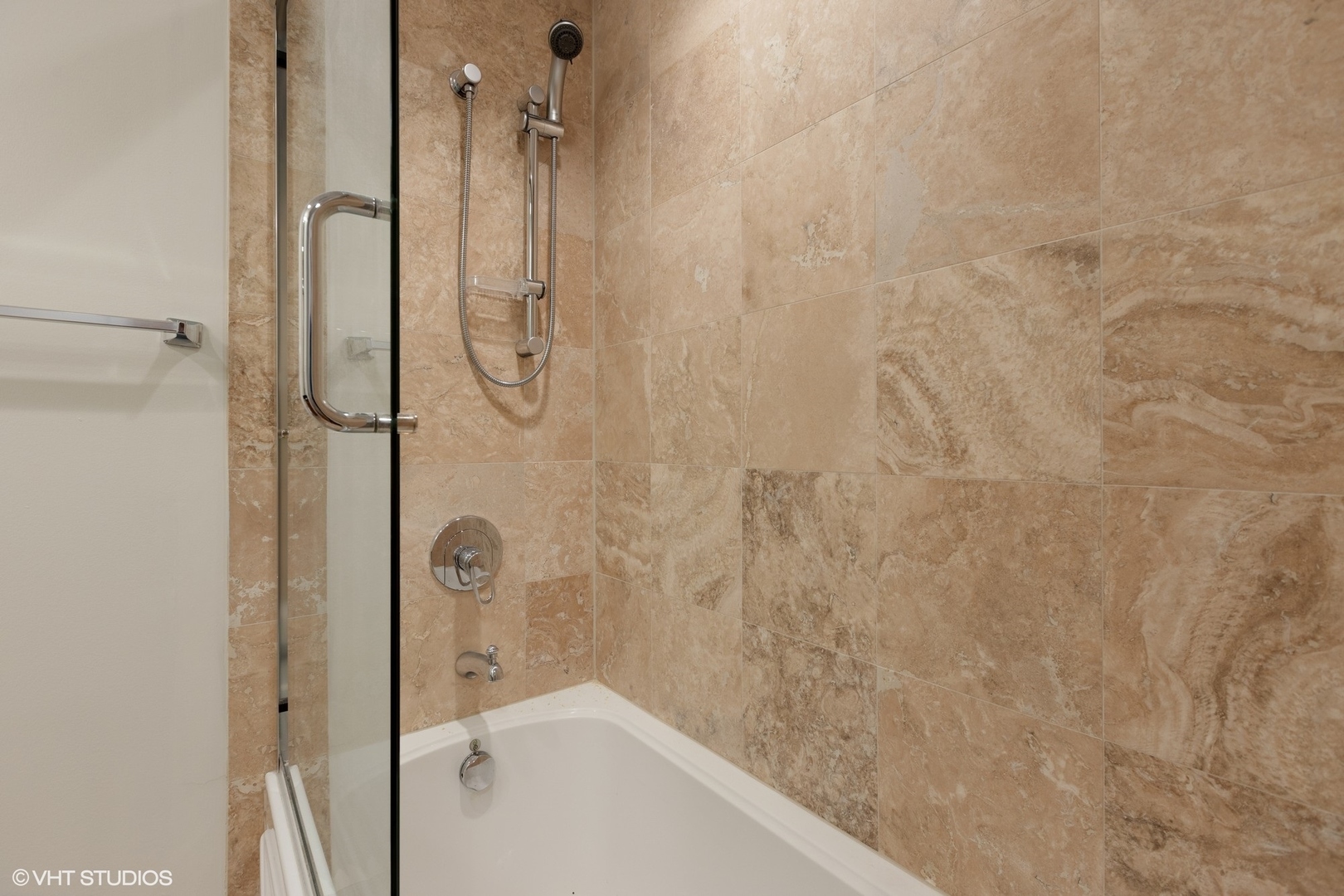 3310 North Halsted Street, Unit 2 Chicago, IL 60657 - Photo 17 of 22 a bathroom with a bathtub and shower