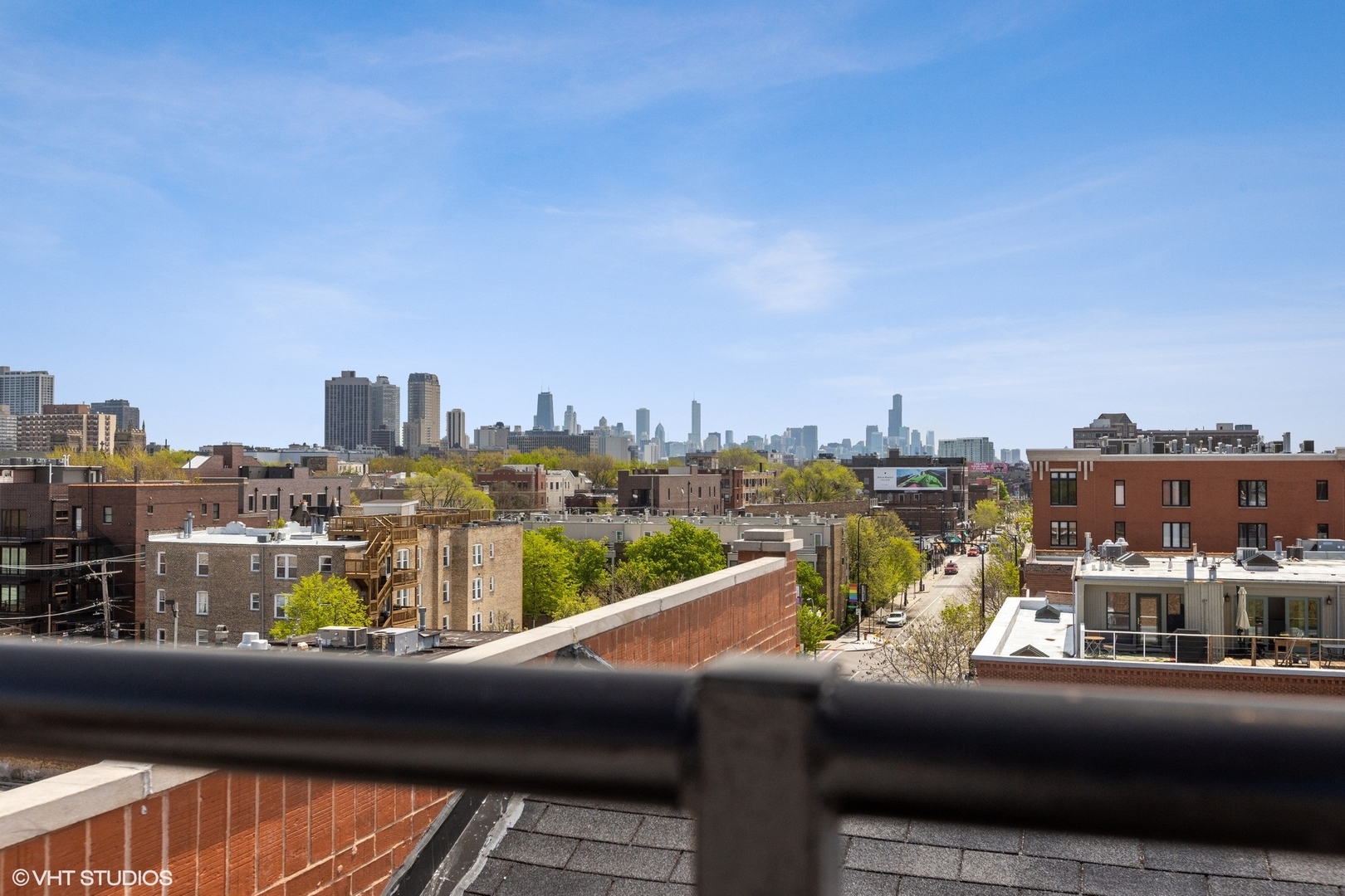3310 North Halsted Street, Unit 2 Chicago, IL 60657 - Photo 20 of 22 a view of a city from a balcony