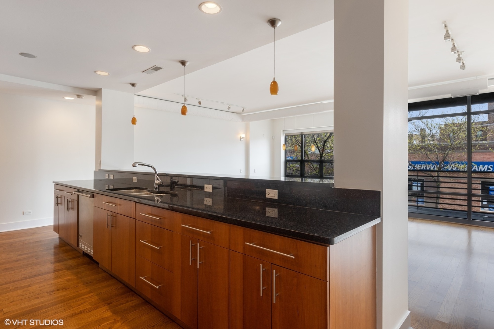 3310 North Halsted Street, Unit 2 Chicago, IL 60657 - Photo 5 of 22 a kitchen with granite countertop a sink and a refrigerator