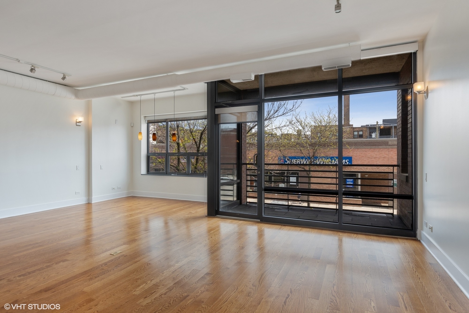 3310 North Halsted Street, Unit 2 Chicago, IL 60657 - Photo 9 of 22 wooden floor in an empty room with a window