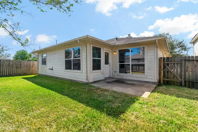 a view of a house with yard and a garden