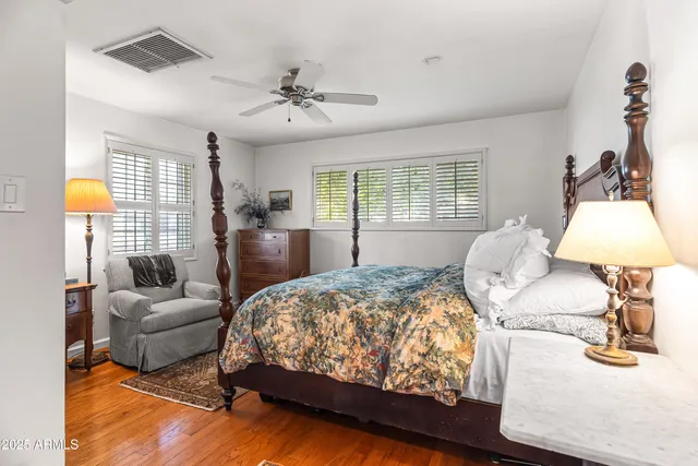 a bedroom with bed and window