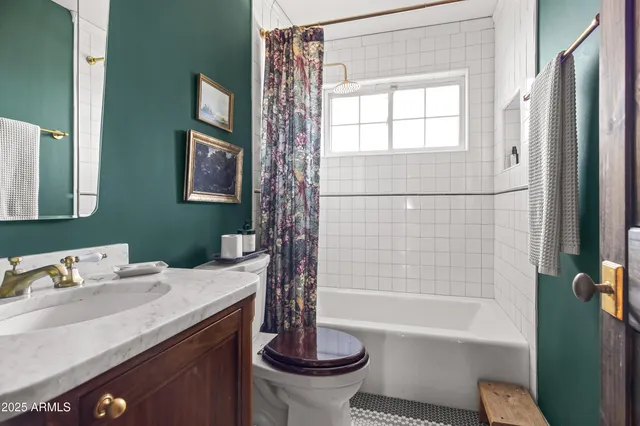 a bathroom with a sink a toilet and a bathtub