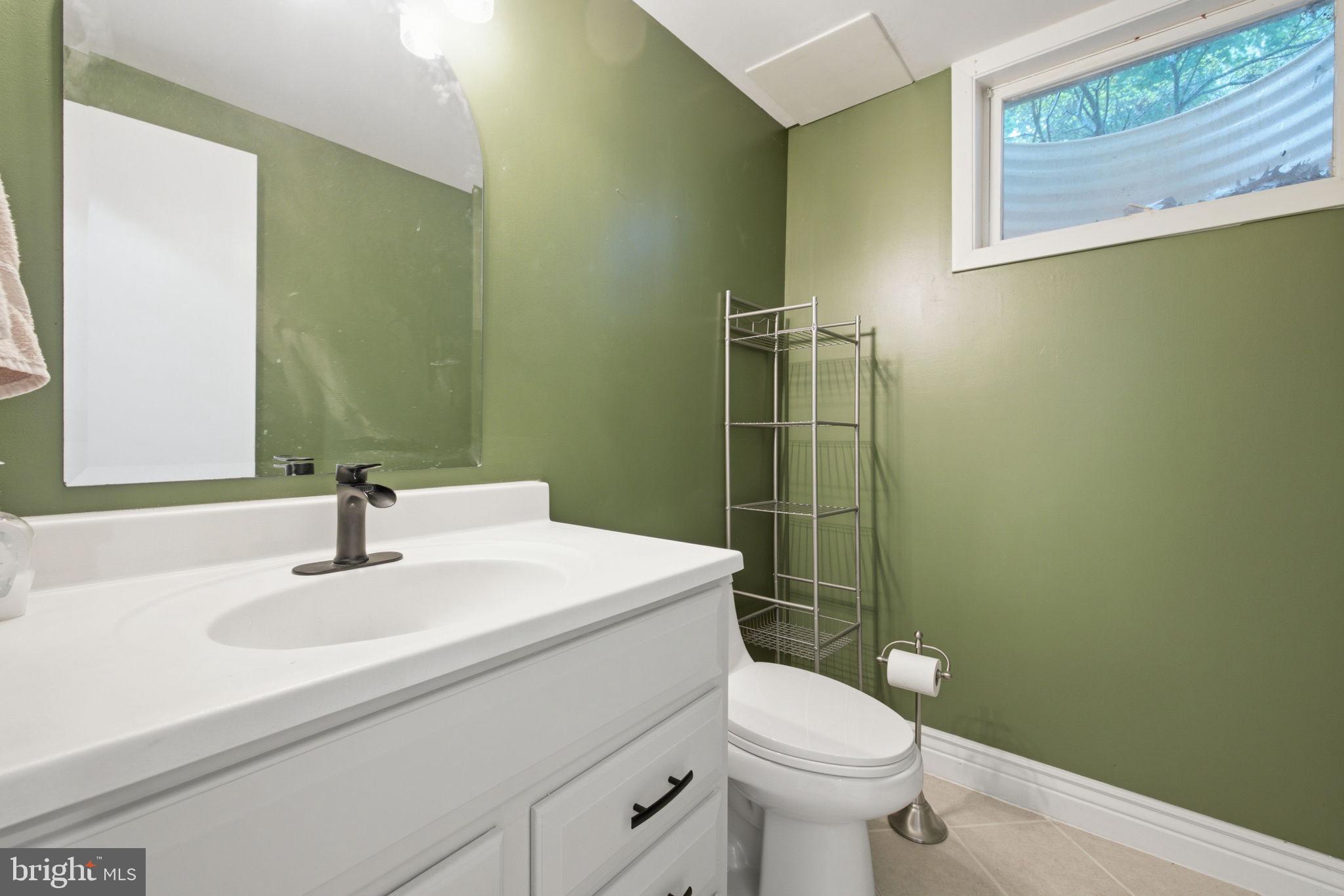 11937 Bayswater Road Gaithersburg, MD 20878 - Photo 38 of 55 Chic green bathroom retreat.