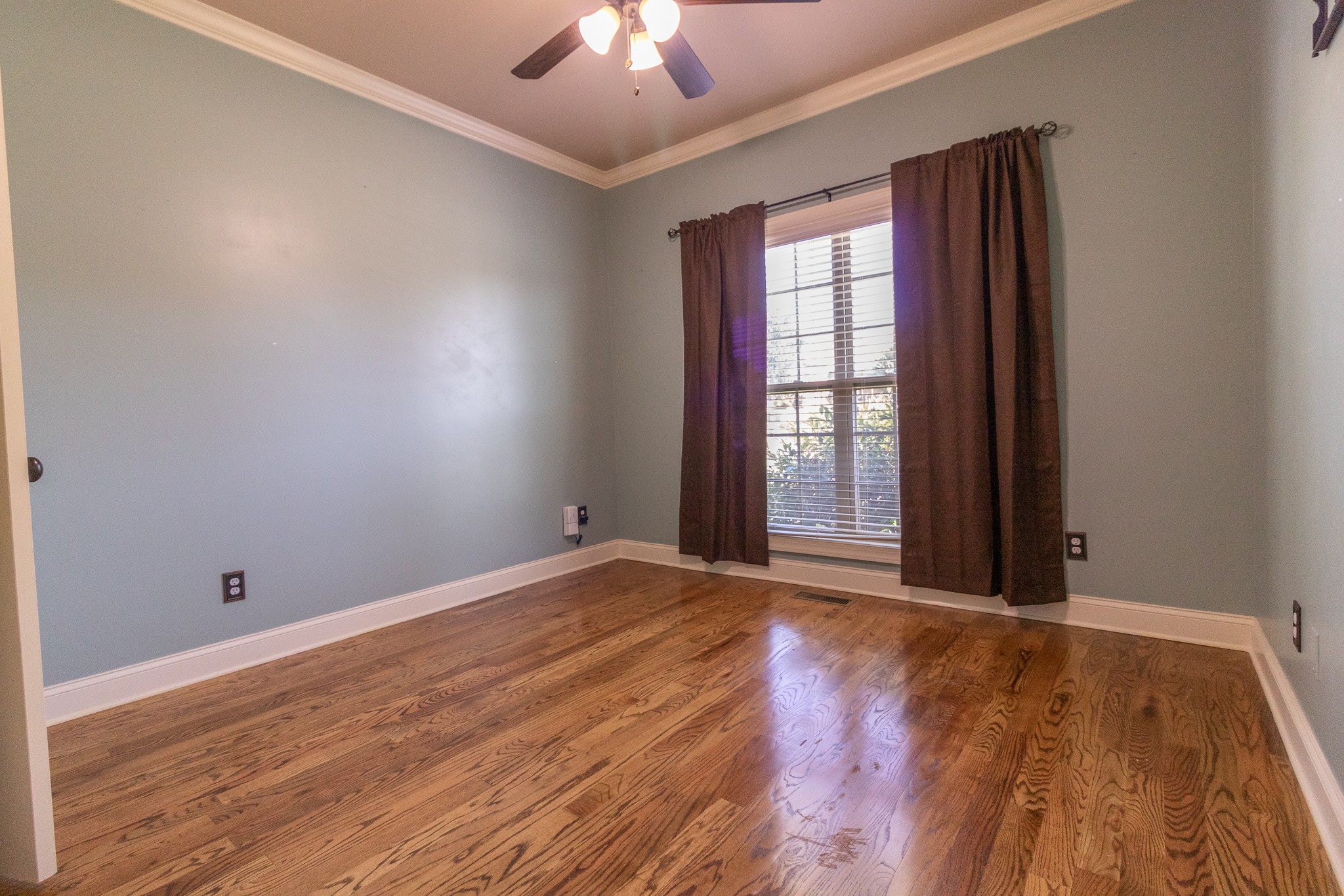 3075 Sakari Circle Spring Hill, TN 37174 - Photo 16 of 35 a view of an empty room with wooden floor and a window