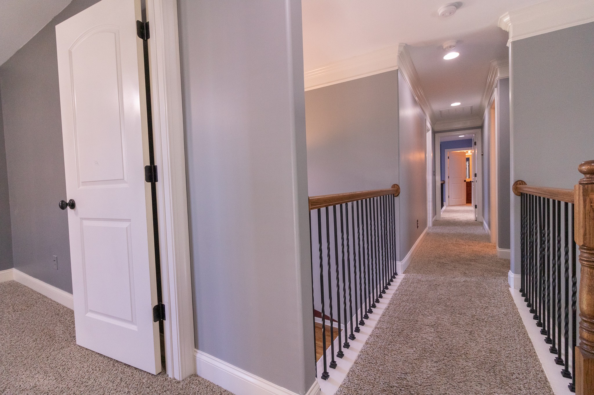 3075 Sakari Circle Spring Hill, TN 37174 - Photo 19 of 35 a view of a hallway with wooden floor and staircase