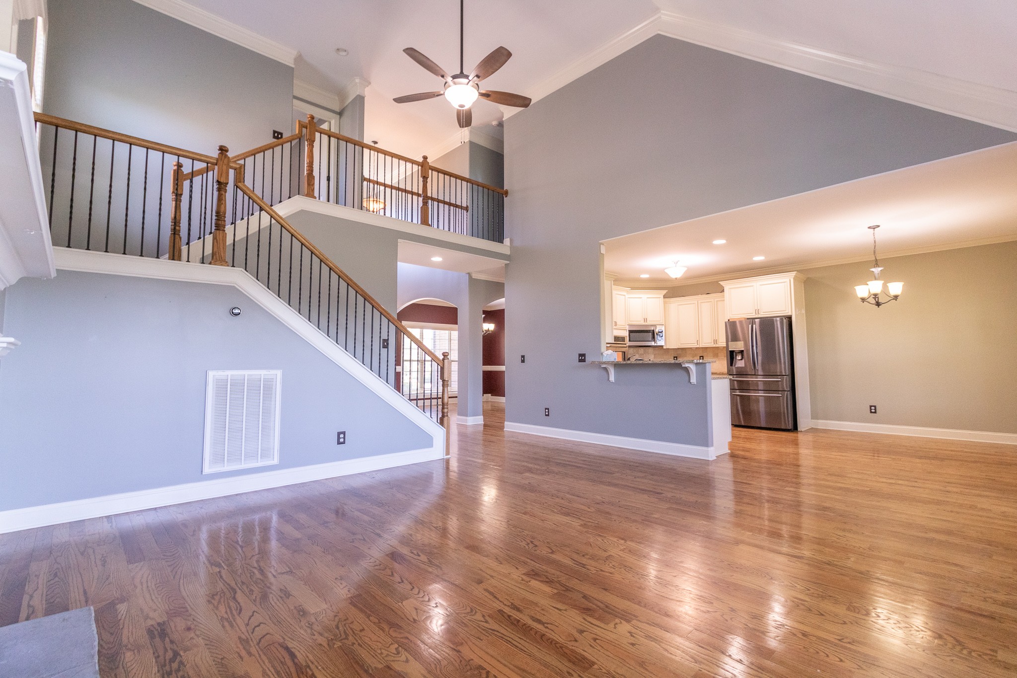 3075 Sakari Circle Spring Hill, TN 37174 - Photo 5 of 35 a view of a livingroom with a ceiling fan and wooden floor