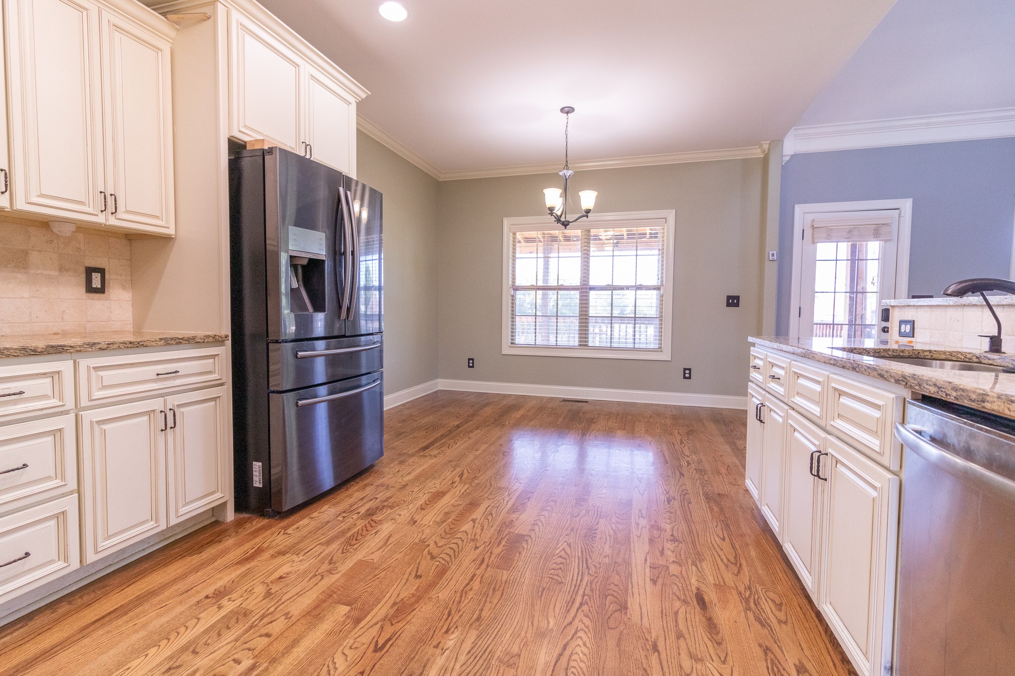 3075 Sakari Circle Spring Hill, TN 37174 - Photo 7 of 35 a kitchen with stainless steel appliances a refrigerator and a stove top oven
