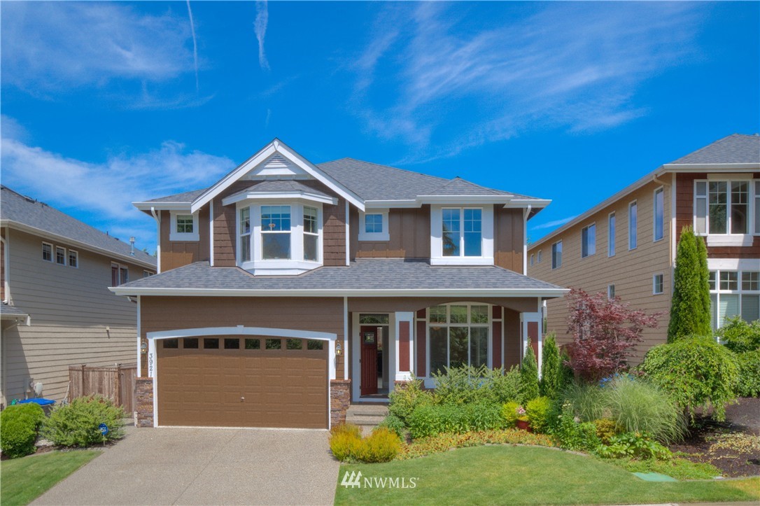 3921 223rd Place Southeast Bothell, WA 98021 - Photo 1 of 1 a front view of a house with garden