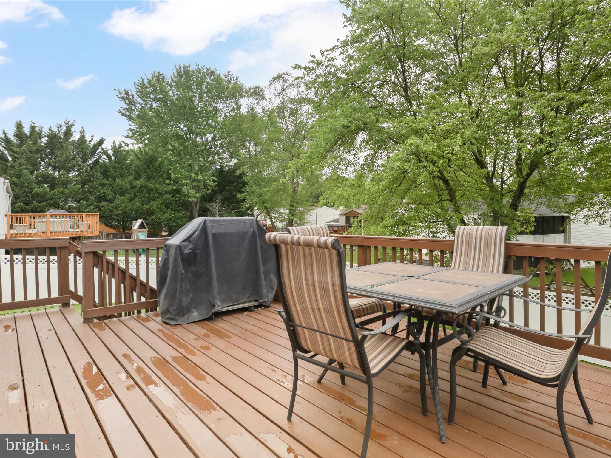 7313 Husky Lane Springfield, VA 22151 - Photo 17 of 49 a view of a deck patio and outdoor seating