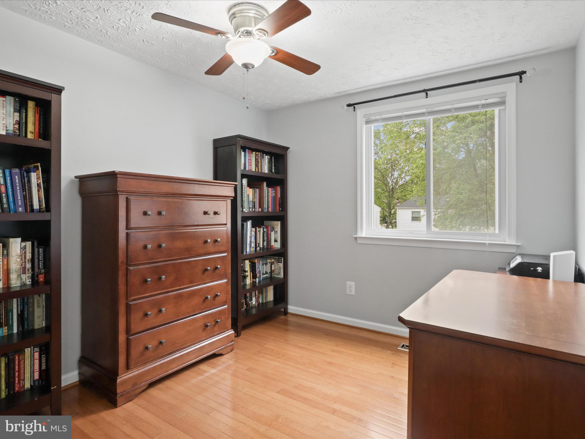 7313 Husky Lane Springfield, VA 22151 - Photo 18 of 49 a view of a workspace with furniture and a window