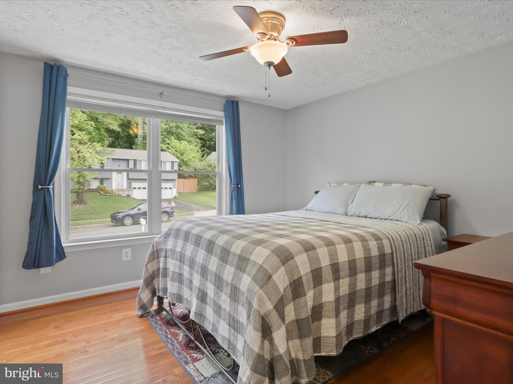 7313 Husky Lane Springfield, VA 22151 - Photo 19 of 49 a bedroom with a bed and a large window