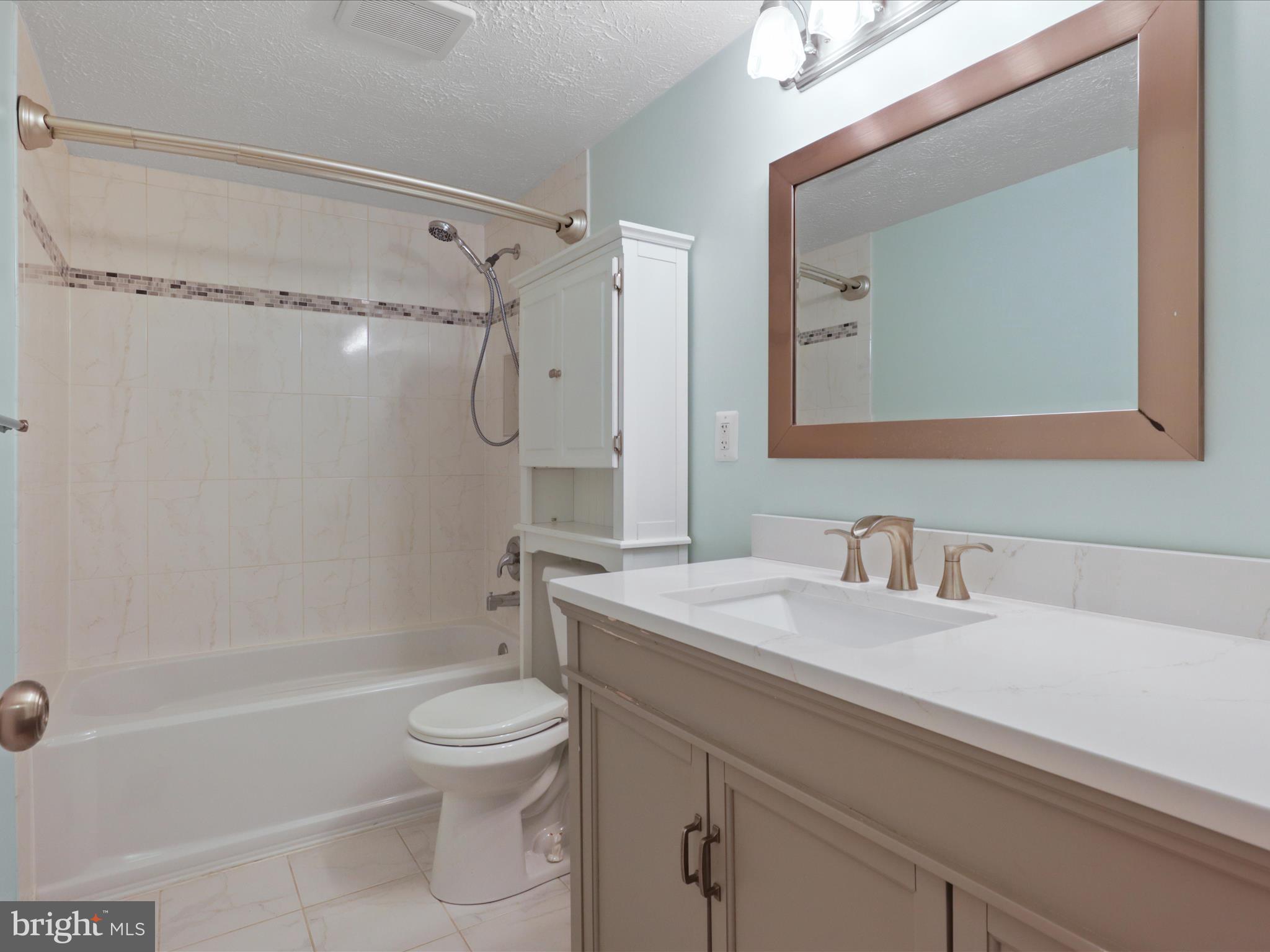 7313 Husky Lane Springfield, VA 22151 - Photo 21 of 49 a bathroom with a sink a toilet and a mirror