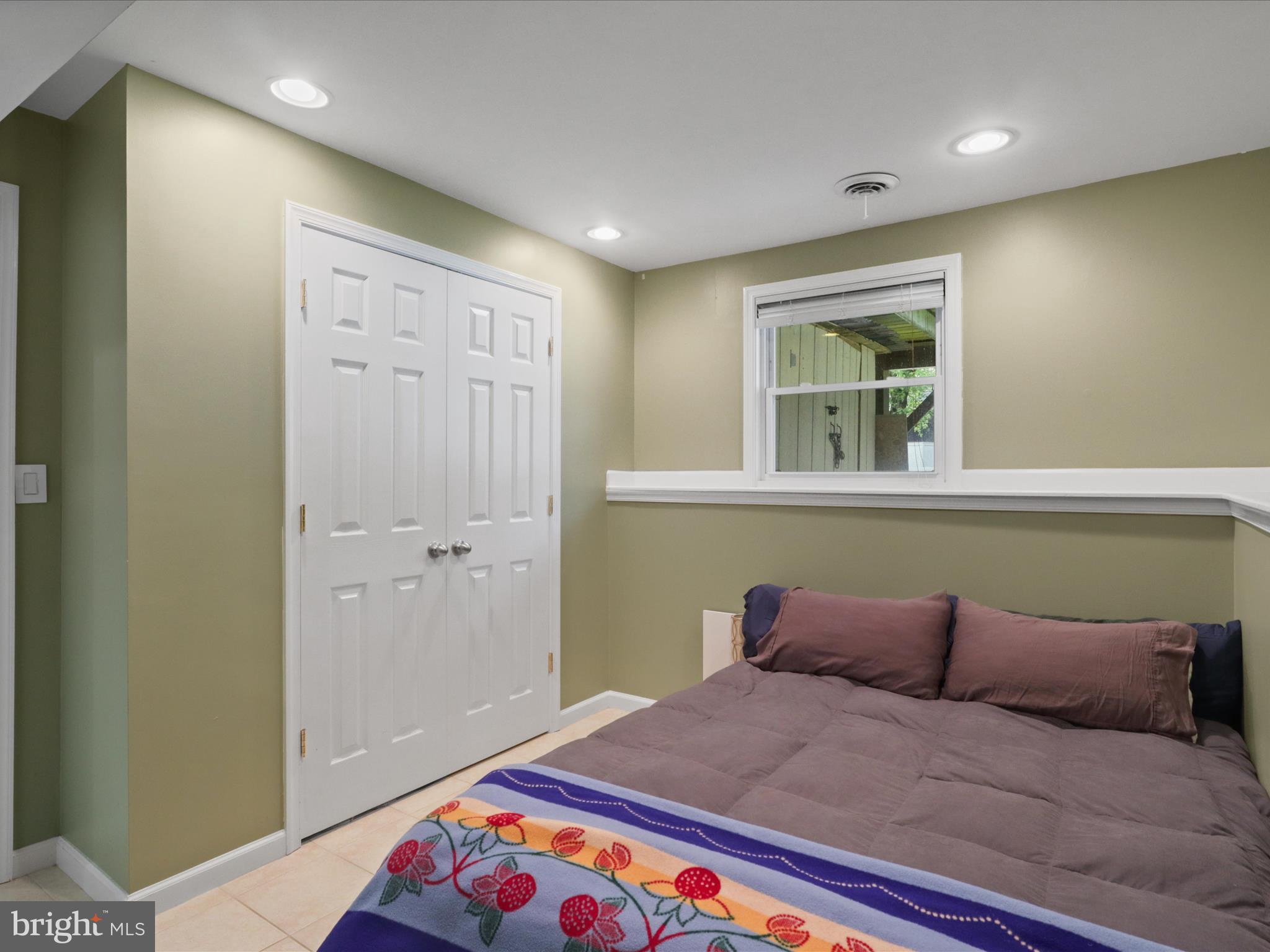 7313 Husky Lane Springfield, VA 22151 - Photo 31 of 49 a bed room with a bed and a window