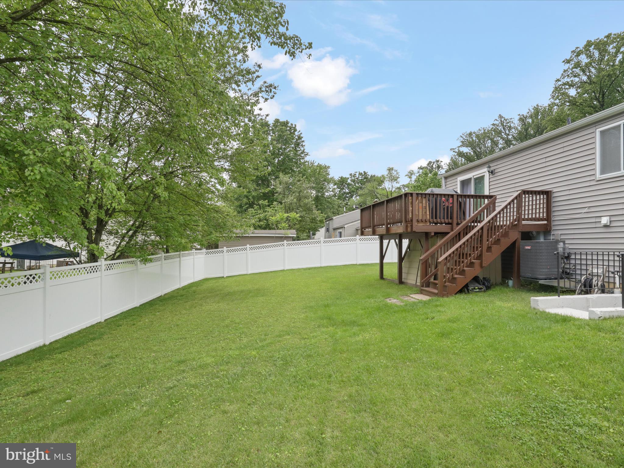 7313 Husky Lane Springfield, VA 22151 - Photo 33 of 49 a view of a house with backyard and a hammock