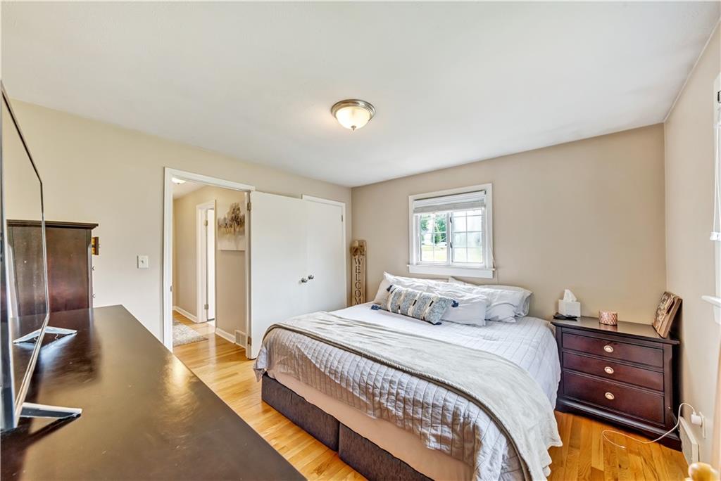 1248 Savannah Road New Castle, PA 16101 - Photo 14 of 25 a bedroom with a bed and a dresser with mirror