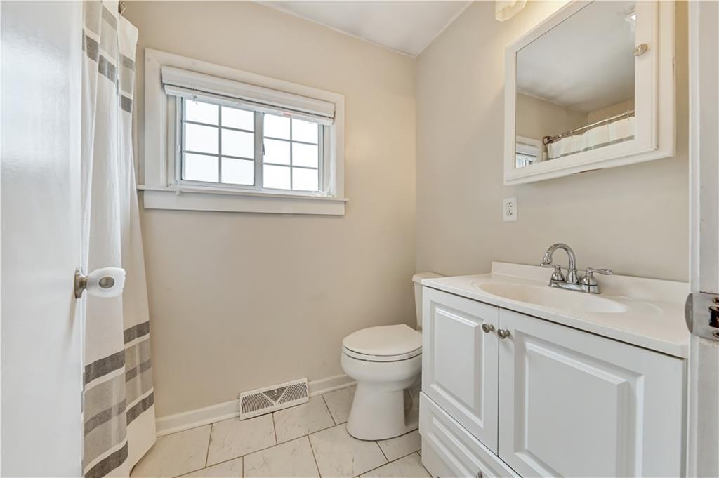 1248 Savannah Road New Castle, PA 16101 - Photo 17 of 25 a bathroom with a toilet sink and mirror