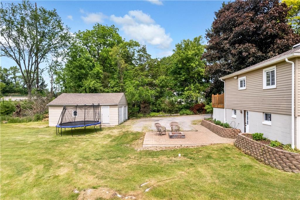 1248 Savannah Road New Castle, PA 16101 - Photo 21 of 25 a view of a house with pool and sitting area