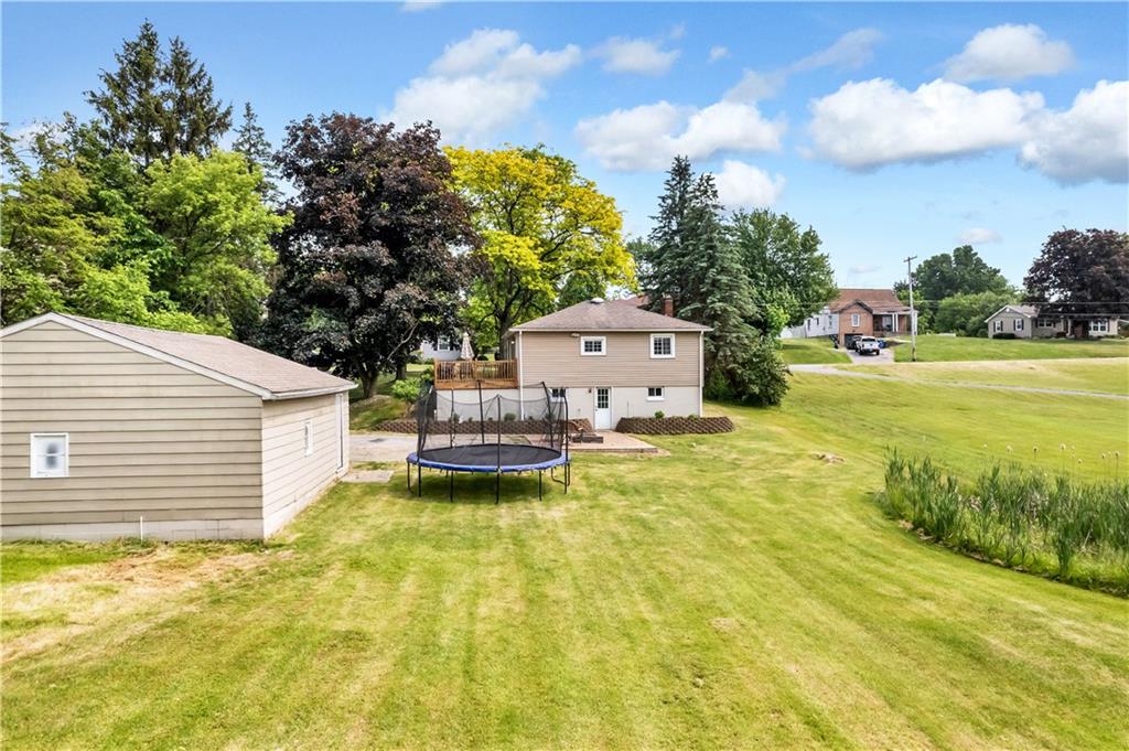 1248 Savannah Road New Castle, PA 16101 - Photo 22 of 25 a swimming pool with plants and large trees
