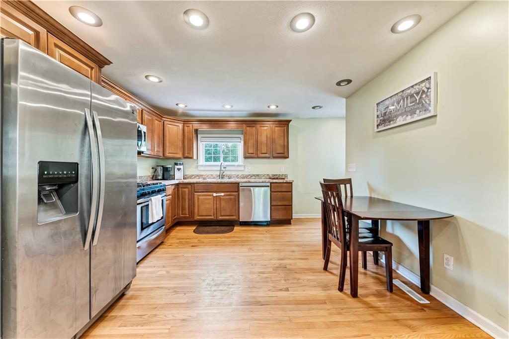 1248 Savannah Road New Castle, PA 16101 - Photo 7 of 25 a kitchen with stainless steel appliances a refrigerator and a stove top oven