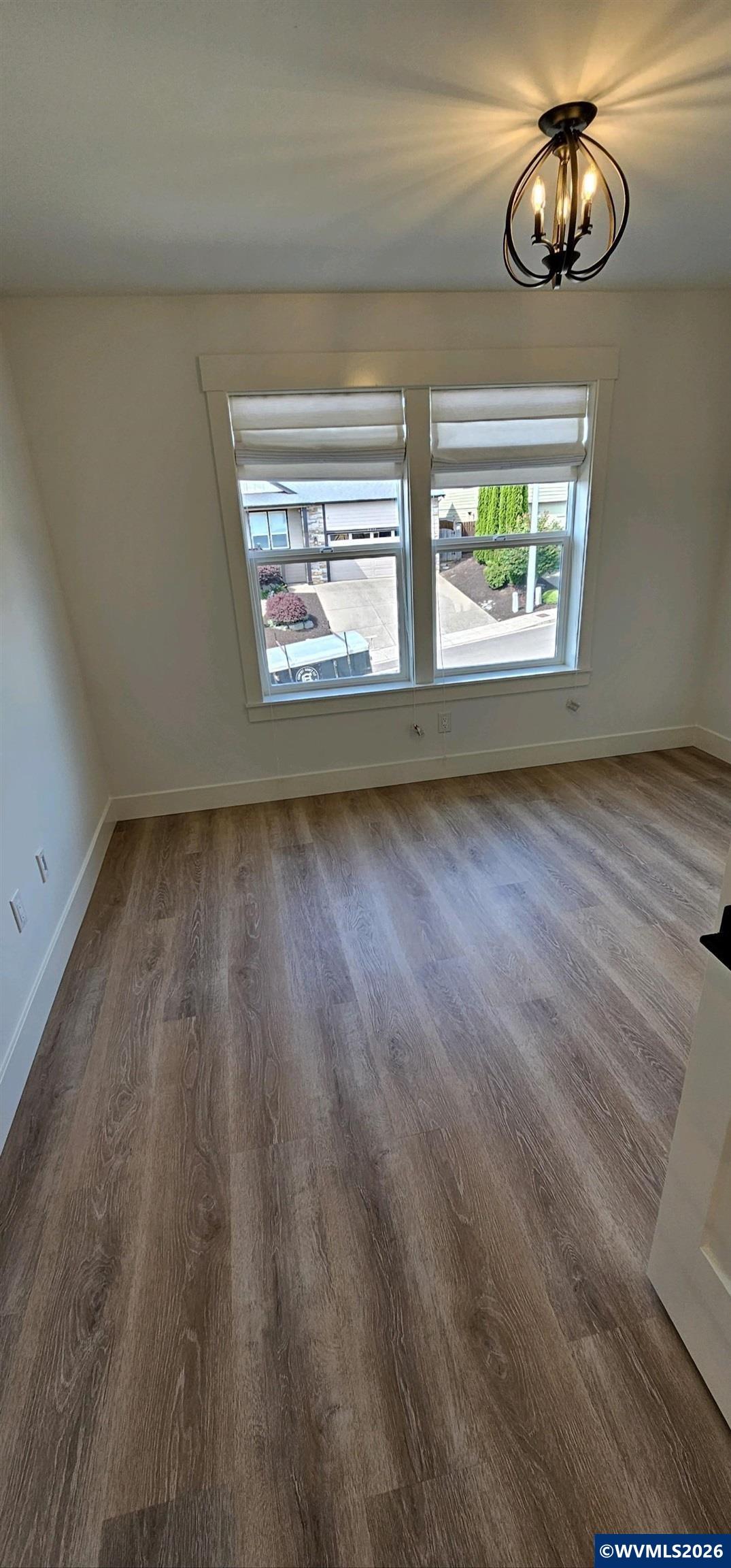 Model B Salishan Street Southeast Salem, OR 97302 - Photo 23 of 30 an empty room with wooden floor and windows