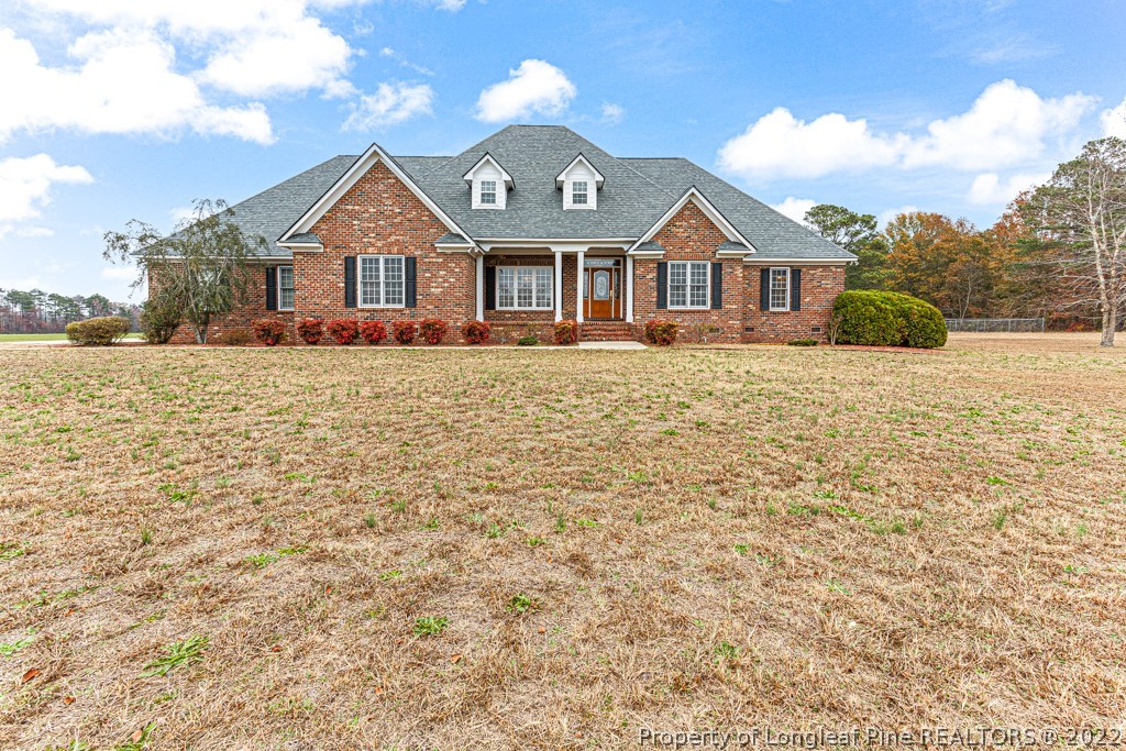 4051 Mt Tabor Road Red Springs, NC 28377 - Photo 1 of 50 a front view of a house with a yard