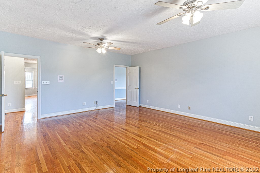 4051 Mt Tabor Road Red Springs, NC 28377 - Photo 13 of 50 wooden floor in an empty room with a window
