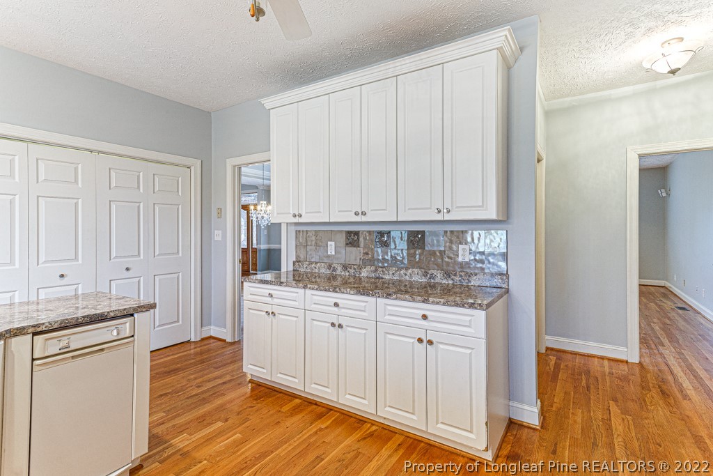 4051 Mt Tabor Road Red Springs, NC 28377 - Photo 15 of 50 a kitchen with white cabinets and sink
