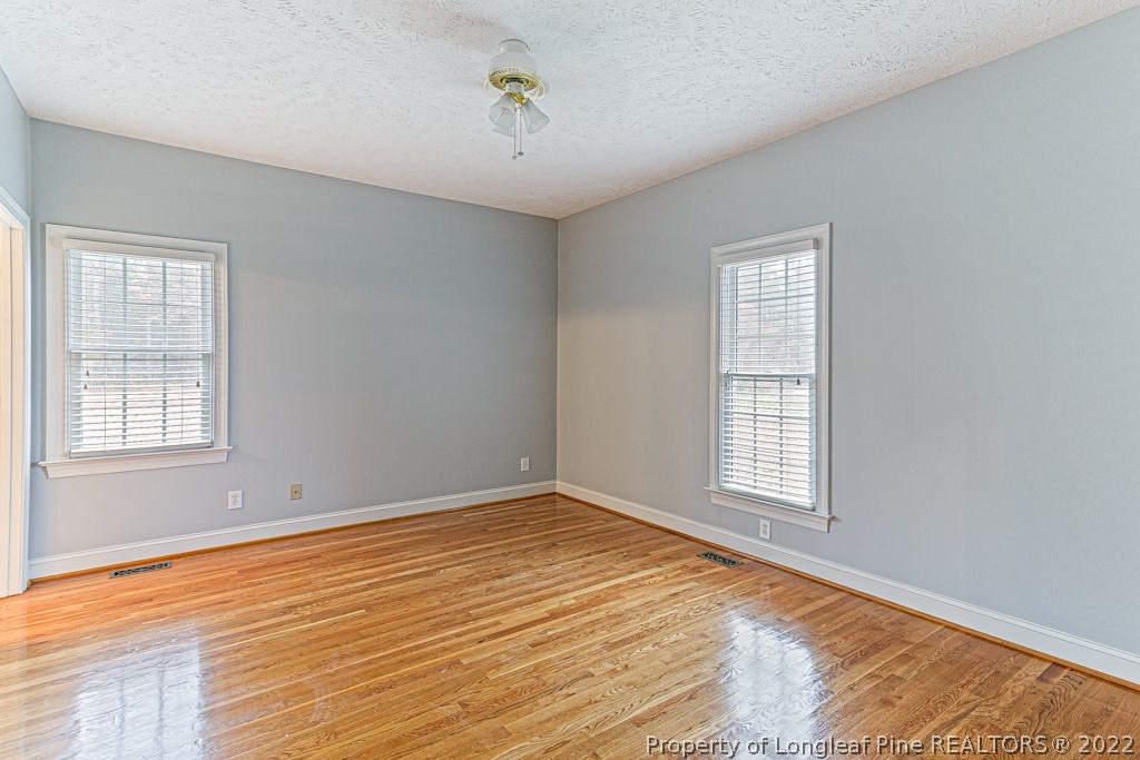 4051 Mt Tabor Road Red Springs, NC 28377 - Photo 25 of 50 a view of an empty room with wooden floor and a window