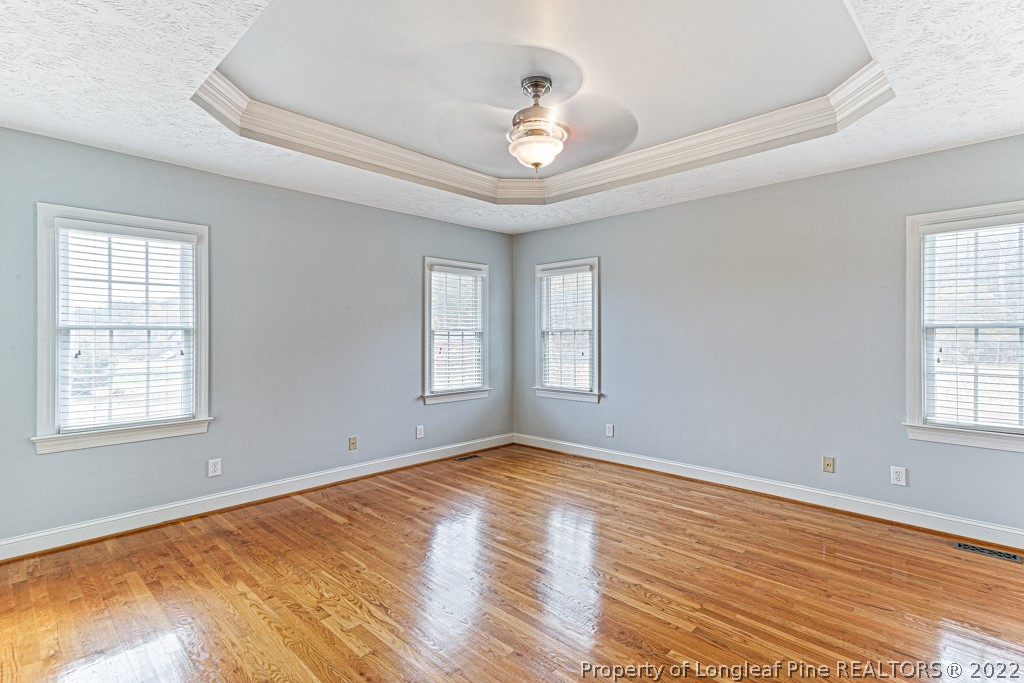 4051 Mt Tabor Road Red Springs, NC 28377 - Photo 29 of 50 a view of empty room with wooden floor and fan